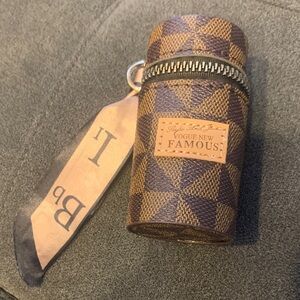 Checkered Brown and Tan Cylinder Bag